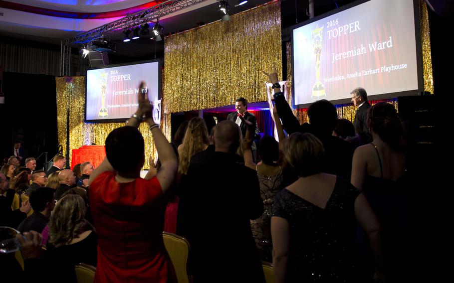 Jeremiah Ward exits the stage after accepting his award for best actor in a musical during the Toppers award show in Kaiserslautern, Germany, on Saturday, April 23, 2016. Ward won for his portrayal of the boy and Matt in the Amelia Earhart Playhouse's production of "The Fantasticks."