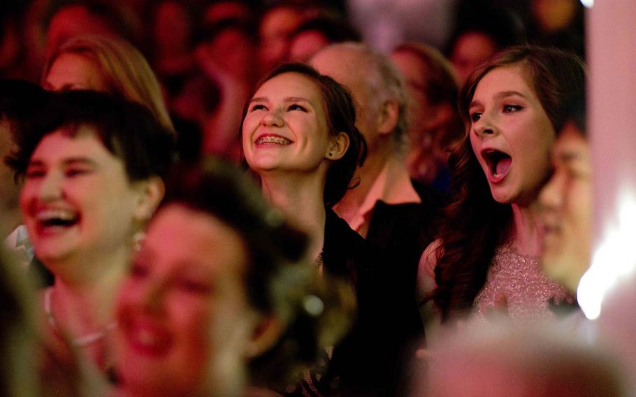 Audience members react during a performance at the annual U.S. Army Tournament of Plays awards show in Kaiserslautern, Germany, on Saturday, April 23, 2016.