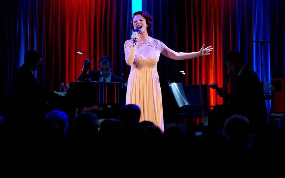 Nicole Soren performs the song "Defying Gravity" during the annual U.S. Army Tournament of Plays awards show in Kaiserslautern, Germany, on Saturday, April 23, 2016.