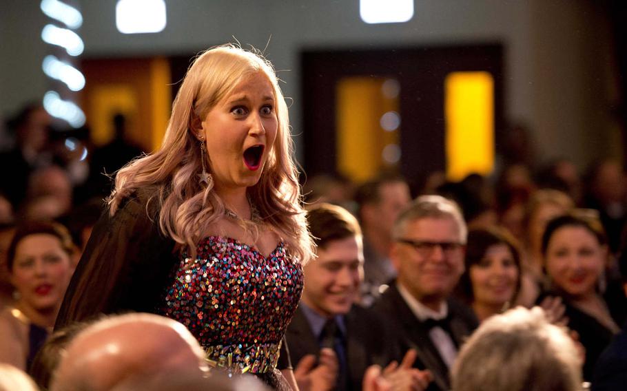 Meaghan Noranbrock reacts after winning best makeup for a play and musical during the annual U.S. Army Tournament of Plays awards show in Kaiserslautern, Germany, on Saturday, April 23, 2016.
                