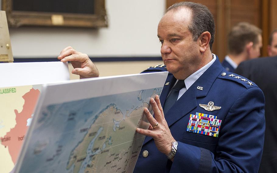 Gen. Philip Breedlove, commander, U.S. European Command and NATO Supreme Allied Commander Europe looks through several maps on display before the start of a hearing at the House Armed Services Committee on Capitol Hill in Washington, D.C., on Thursday, Feb. 25, 2016.