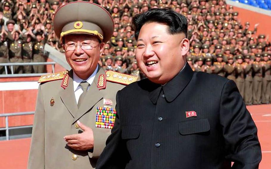 North Korean leader Kim Jong Un, right, is seen with North Korean general Ri Yong Gil in this undated photo from the Korean Central News Agency. The general, who was believed to have been executed earlier this year, is apparently alive and back in a senior military position, South Korean officials said Tuesday, May 10, 2016.