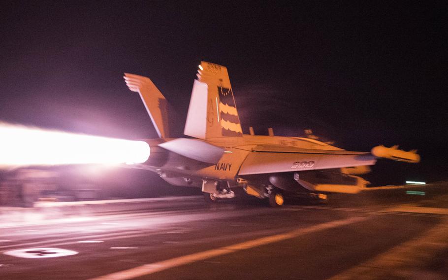 An EA-18G Growler, assigned to the ''Patriots'' of Electronic Attack Squadron 140, launches from the flight deck of aircraft carrier USS Harry S. Truman on Dec. 28, 2015. The Growler can jam radio and cell phone communications, which the enemy could try to use to coordinate ambushes or other forms of attacks