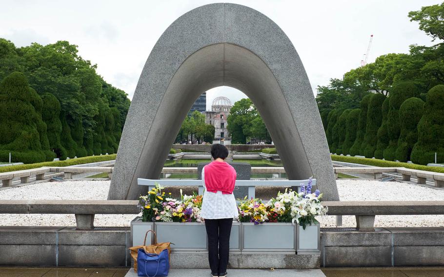In this photo from June 9, 2015, a woman prays for atomic-bombing victims at the Memorial Cenotaph in Hiroshima, Japan. The memorial holds the names of all of the victims of the bombing on Aug. 6, 1945. Korean victims, the largest group of non-Japanese victims of the 1945 atomic strikes, are hoping President Barack Obama's historic trip to Hiroshima this week will draw attention to their fight to gain recognition and reparations.