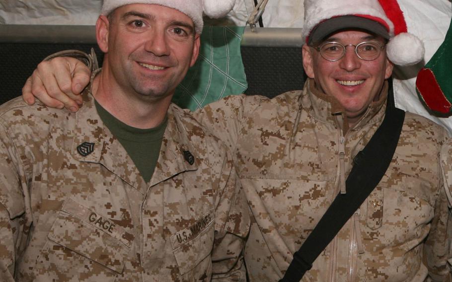 Paul Gage, left, stands next to Mike McNamara during a Christmas party in Afghanistan in 2010. Gage and McNamara are creating a streaming talk radio show hoping to engage listeners and callers in the Marines' culture and reconnect isolated Marines with their "tribe."
