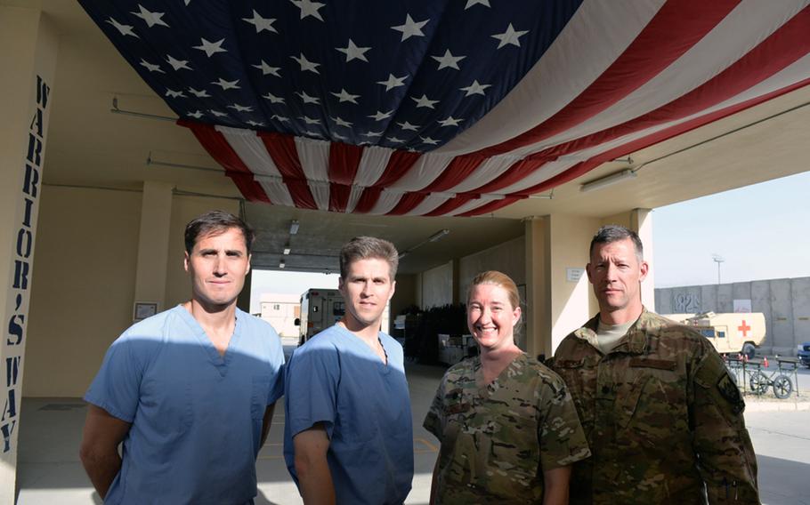 Surgeons of the U.S. Air Force’s 455th Expeditionary Medical Group at Bagram Air Field are pictured here in Warrior Way outside Craig Joint Theater Hospital on Friday, June 10, 2016. From left to right are Lt. Col. Stephen Maturo, Maj. Phillip Parry, “Trauma Czarina” Lt. Col. Jamie Rand and Lt. Col. Chance Henderson.