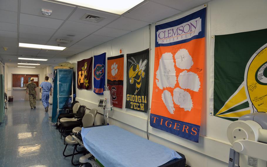 Flags of U.S. sports teams send in care packages adorn the walls inside Craig Joint Theater Hospital at Bagram Air Field on Friday, June 10, 2016. The hospital was quiet, as demand for its services has decreased with the drawdown in international coalition combat forces since late 2014.