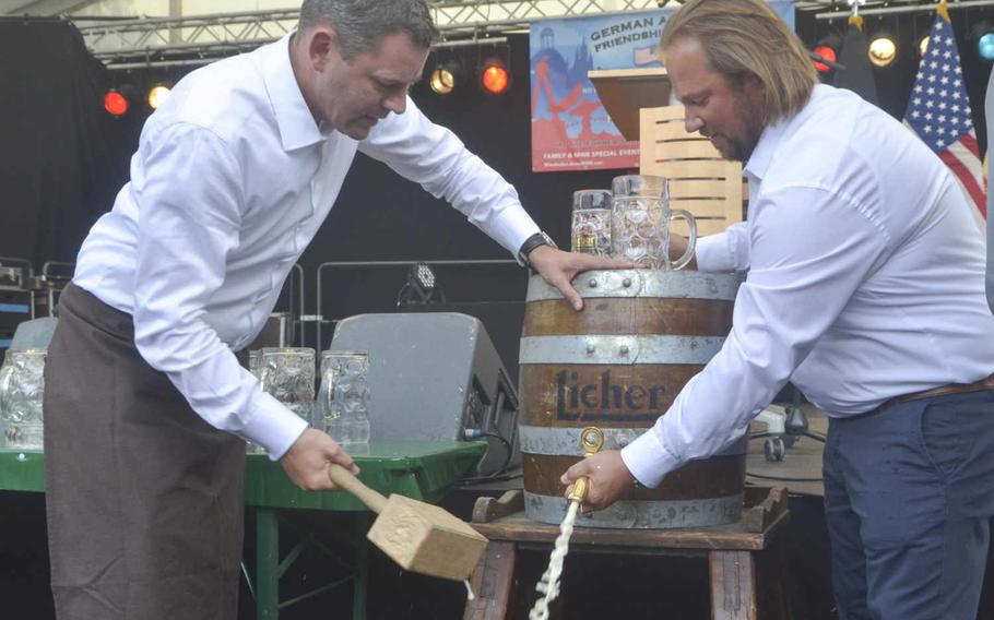 Wiesbaden Mayor Sven Gerich, left, and German-American Friendship Festival manager Joe Harris tap a keg of beer, signaling the event's opening on Thursday, June 30, 2016. The festival entertained thousands of Americans and Germans over its five-day run, set to end Monday, July Fourth, with a large fireworks display. Dan Stoutamire/Stars and Stripes