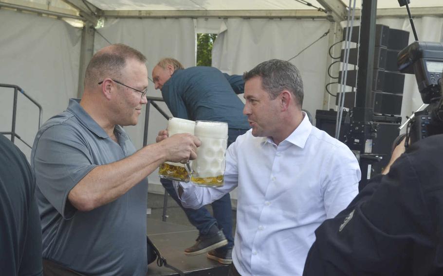 U.S. Army Garrison Wiesbaden commander Col. Todd Fish, left, and Wiesbaden Mayor Sven Gerich toast the opening of the German-American Friendship Festival in Wiesbaden, Thursday, June 30, 2016. Fish said the event is a great way for Americans and their German hosts to socialize.