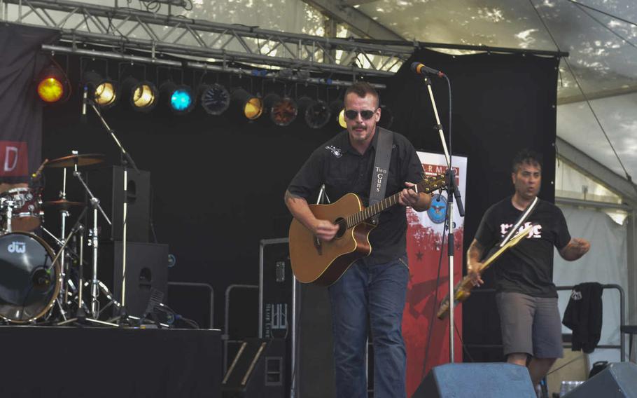 Members of the band American Hitmen play for the crowd at the German-American Friendship Festival, Sunday, July 3, 2016 in Wiesbaden. The band is made up of U.S. Marine Corps combat veterans. Dan Stoutamire/Stars and Stripes