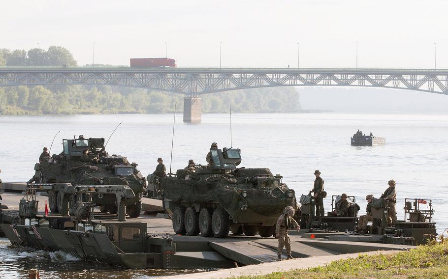 U.S. Army Strykers belonging to the 2nd Cavalry Regiment cross the Vistula River in Chelmno, Poland, on Wednesday, June 8, 2016.This has been the summer of war games in Europe, where thousands of NATO troops have been on the move in a series of eye-catching military drills stretching from Poland to the Baltics and beyond.