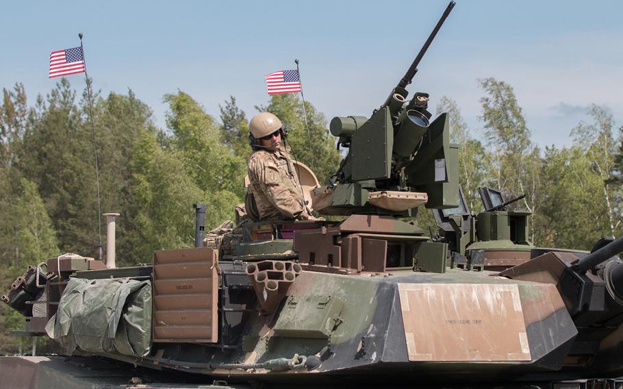An American tanker riding a M1A2 SEP Abrams battle tank heads to the firing range on Wednesday, May 11, 2016, as part of the 2016 Strong Europe Tank Challenge held at the Grafenwoehr, Germany, training area. The U.S. Army in Europe is moving more tanks and troops to the Continent, with plans next year for a heavy brigade to be on year-round loan from the States, adding a third full brigade to the two already in Europe.