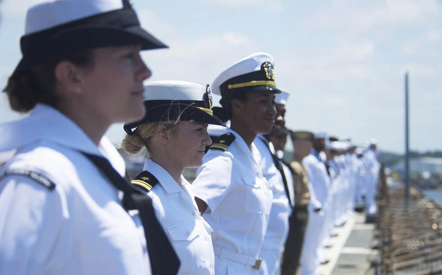 Sailors and Marines man the rails as the dock landing ship USS Whidbey Island departs for deployment, June 25, 2016. The Navy has announced a revision to its Selective Re-enlistment Bonus program that decreases 25 award levels and removes four skills from a list released earlier this year.