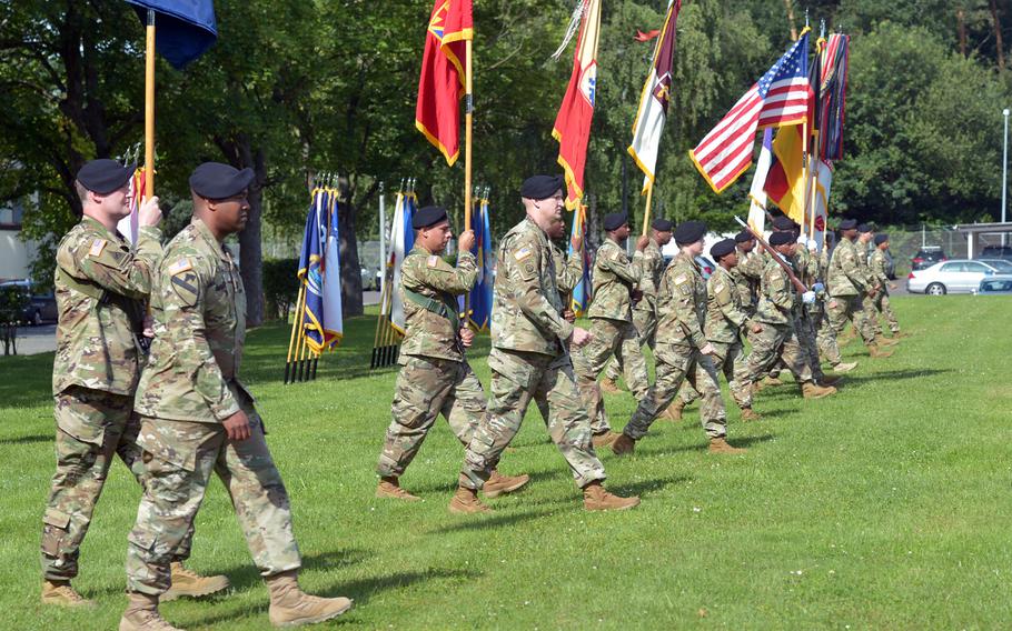 The U.S. Army Garrison Rheinland-Pfalz color guard and soldiers representing the units within the garrison's footprint march across the parade field at USAG's change-of-command ceremony in Kaiserslautern, Germany, Wednesday, July 6, 2016. Col. Keith Igyarto took command from Col. G. Shawn Wells Jr. at the ceremony.