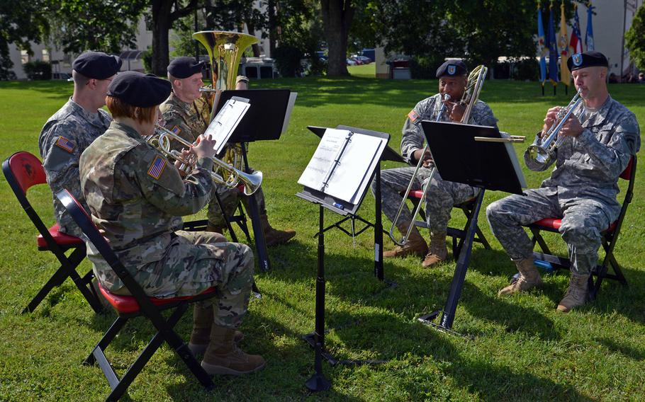 The U.S. Army Europe Band's brass quintet plays during the U.S. Army Garrison Rheinland-Pfalz change-of-command ceremony in Kaiserslautern, Germany, Wednesday, July 6, 2016. 
