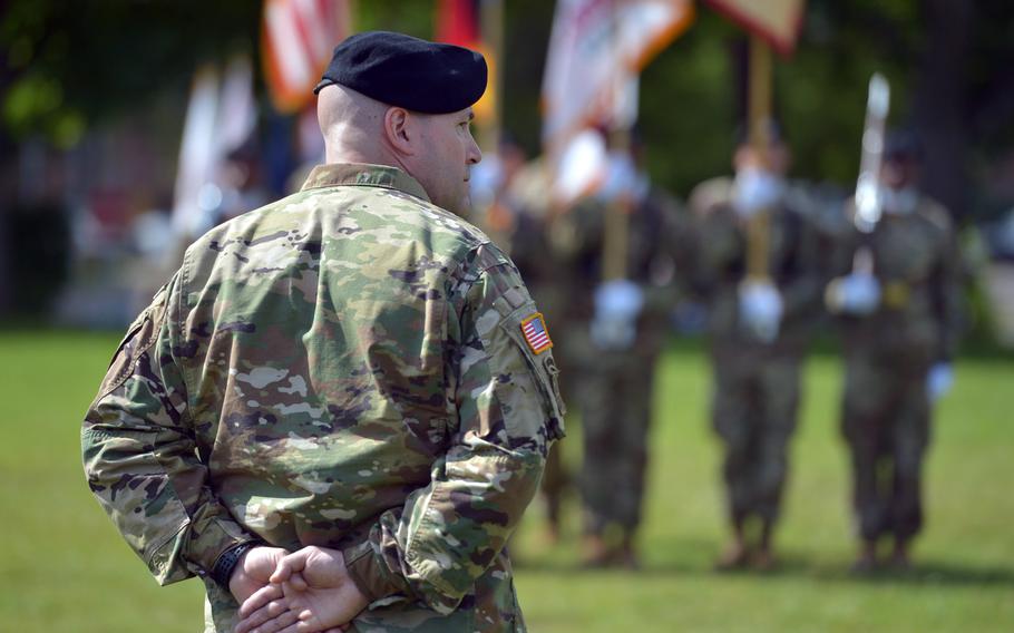 Incoming U.S. Army Garrison Rheinland-Pfalz commander Col. Keith Igyarto listens as the outgoing commander, G. Shawn Wells Jr., speaks at the garrison's change-of-command ceremony n Kaiserslautern, Germany, Wednesday, July 6, 2016.