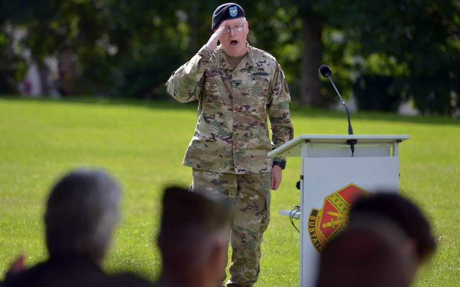 Outgoing commander of U.S. Army Garrison Rheinland-Pfalz, G. Shawn Wells Jr., gives a final salute and ''hooah'' at the garrison's change-of-command ceremony n Kaiserslautern, Germany, Wednesday, July 6, 2016.