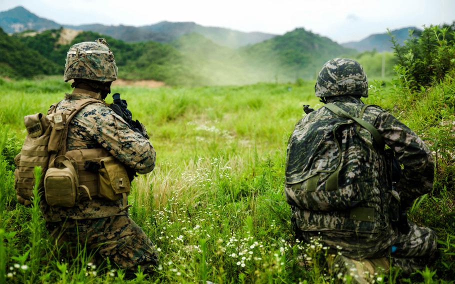 A U.S. Marine and Republic of Korea Marine shoot live rounds side-by-side July 6, 2016 at Suseong Range, South Korea during a Korean Marine Exchange Program. The goal of the KMEP is to sustain the combined force and enhance the ROK-U.S. team at the tactical level to build combined warfighting capabilities. During this exercise the Marines carried out a bilateral regimental-sized Marine Air Ground Task Force operation for the first time. The ROK Marines were a part of 73rd Battalion, 7th Regiment, 1st Marine Division. The U.S. service members are a part of 2nd platoon, Fox Company, 2nd Battalion, 2nd Marine Regiment, currently attached to 4th Marine Regiment, III Marine Expeditionary Force through the unit deployment program.