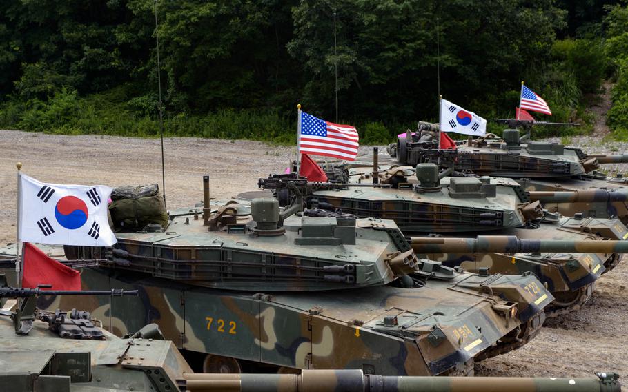 U.S. and South Korean tanks bearing national flags line up before advancing toward their target during a joint training exercise as part of a Korean Marine Exchange Program with visiting U.S. Marines. The exercise on July 6 was the culmination of weeks of planning and rehearsals. It was held on the Suseong Range near the southeastern city of Pohang.
