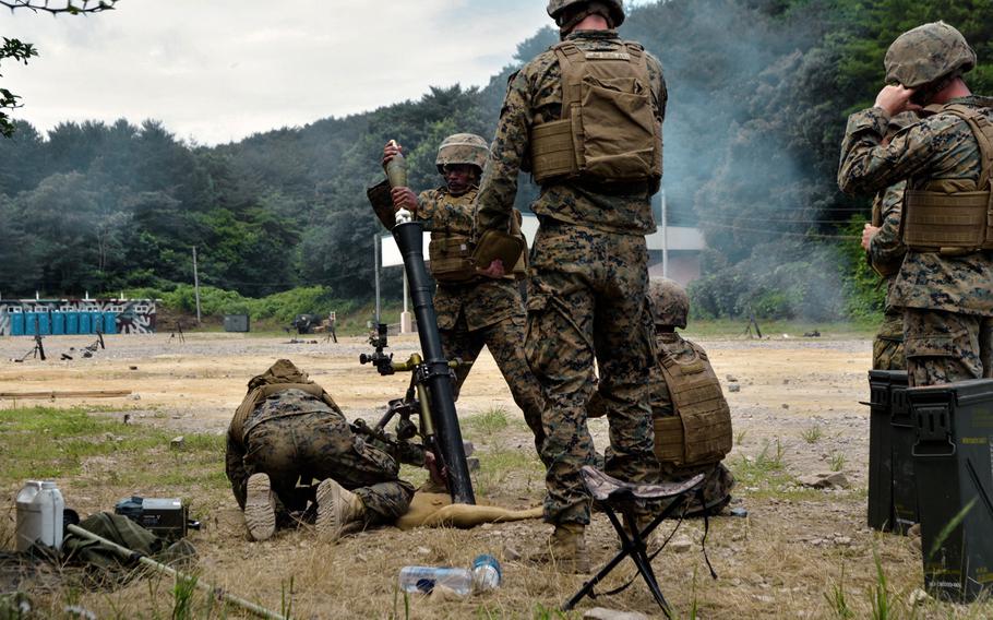 U.S. Marines fire mortar rounds as the attack begins during a joint training exercise as part of a Korean Marine Exchange Program with visiting U.S. Marines. The exercise on July 6 was the culmination of weeks of planning and rehearsals. It was held on the Suseong Range near the southeastern city of Pohang.