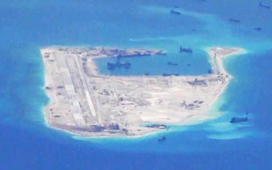 This photo from May 2015 shows a Chinese airstrip under construction at Fiery Cross Reef, part of the disputed Spratly Islands in the South China Sea. The artificial island now includes a military-capable airstrip, possible gun emplacements, radar towers, helipads and communications equipment, according to the Asia Maritime Transparency Initiative.