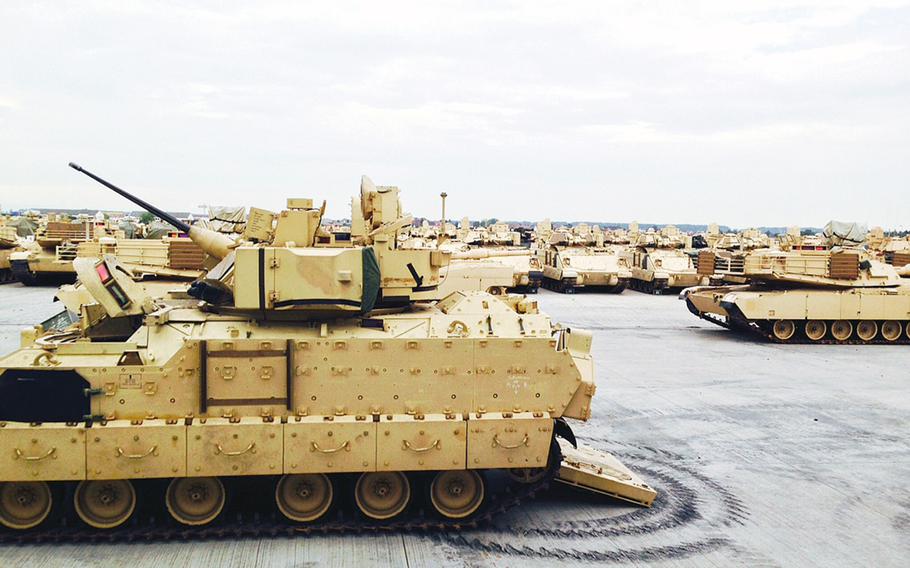 U.S. Army armored vehicles sit at Coleman Barracks in Mannheim, Germany, Tuesday, Sept. 1, 2015. In October, USAREUR will move into Tower Barracks, a former British facility in the northwestern German town of Duelmen, to store tanks and other combat equipment flowing into Europe as part of a Pentagon plan to position more firepower on the Continent.