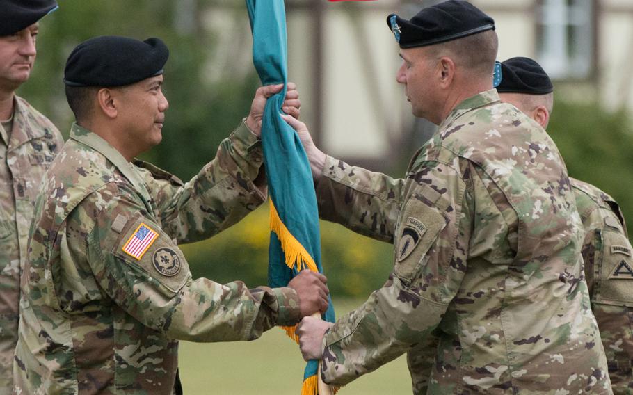 Brig. Gen. Antonio Aguto receives the guidon from U.S. Army Europe commander Lt. Gen Ben Hodges during the change-of-command ceremony at the Army training facility in Grafenwoehr, Germany on July 15, 2016.