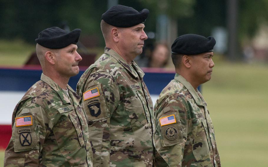 Maj. Gen. Christopher Cavoli, U.S. Army Europe commander Lt. Gen Ben Hodges, and 7th Army Training Command's newest commander, Brig. Gen. Antonio Aguto, left to right, stand in formation during Aguto's change-of-command ceremony in Grafenwoehr, Germany on July 15, 2016.