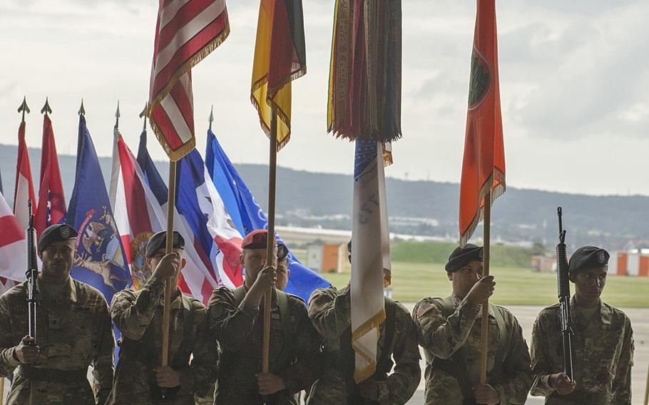 Members of the 5th Signal Command color guard stand at attention during a change-of-command ceremony on July 15, 2016, at Clay Kaserne in Wiesbaden, Germany. Col. Jimmy L. Hall, who took command in May 2014, handed over responsibility to Col. Rob Parker during the ceremony.
