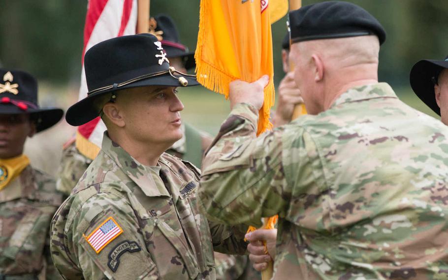 Col. Patrick Ellis, left, receives the guidon from U.S. Army Europe?s deputy commander, Maj. Gen. Timothy McGuire, during a change-of-command ceremony for the 2nd Cavalry Regiment in Vilseck, Germany, Friday, July 15, 2016. Ellis assumed command of the unit from Col. John Meyer. Michael S. Darnell/Stars and Stripes