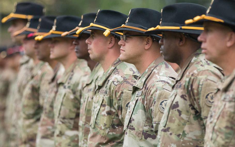 Second Cavalry Regiment soldiers stand in formation during the ceremony in which Col. John Meyer relinquished command to Col. Patrick Ellis at Rose Barracks in Vilseck, Germany, on Friday, July 15, 2016. Michael S. Darnell/Stars and Stripes