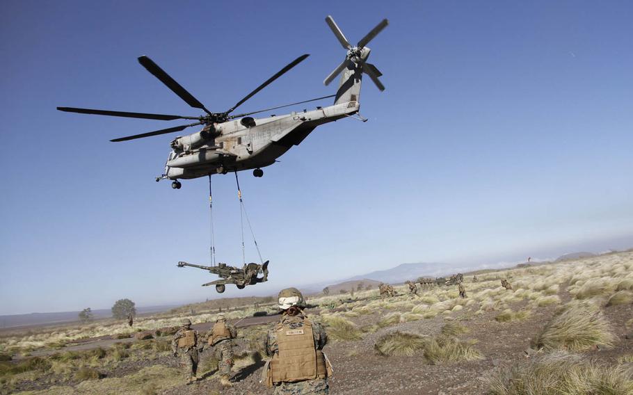 A Super Stallion helicopter takes off with a 10,000-pound howitzer cannon at Pohakuloa Training Area on the big island of Hawaii, July 19, 2016. "It never feels easy doing this," said Lt. Col. Benjamin Harrison, commander of the 1st Battalion, 12th Marines, adding that there's a lot at stake when you're risking injuries and a lot of money by hoisting a $1 million-plus weapon in the air.