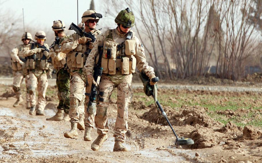 Estonian troops clear a road in Helmand province, Afghanistan, April 4, 2012. NATO?s east European members are perplexed by criticism from Republican presidential nominee Donald Trump that the Europeans are not pulling their weight when it comes to paying for the cost of the alliance. U.S. Marines