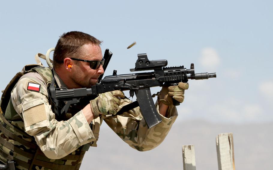 A Polich servicemember of Task Force White Eagle participates in a live fire range June 5, 2015 at Tactical Base Gamberi in eastern Afghanistan. Some east European NATO members are perplexed by Donald Trump's criticisms about financial burden-sharing in the alliance. Charlie Emmons/U.S. Army