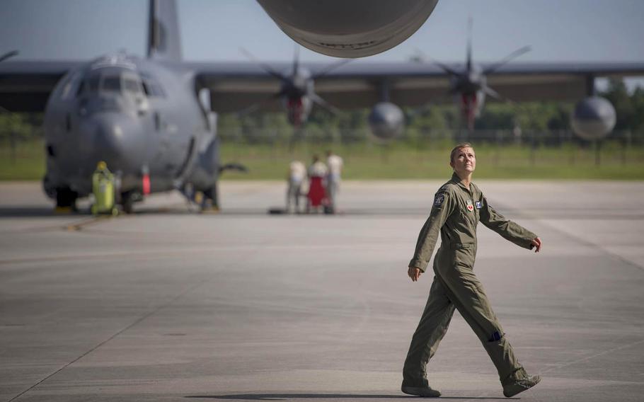 Air Force Capt. Christy Wise, a pilot with the 71st Rescue Squadron at Moody Air Force Base, Ga., checks the wing of an HC-130J Combat King II , July 22, 2016. Wise is the sixth Air Force pilot to return to the cockpit after becoming an amputee and the first female amputee to do so.