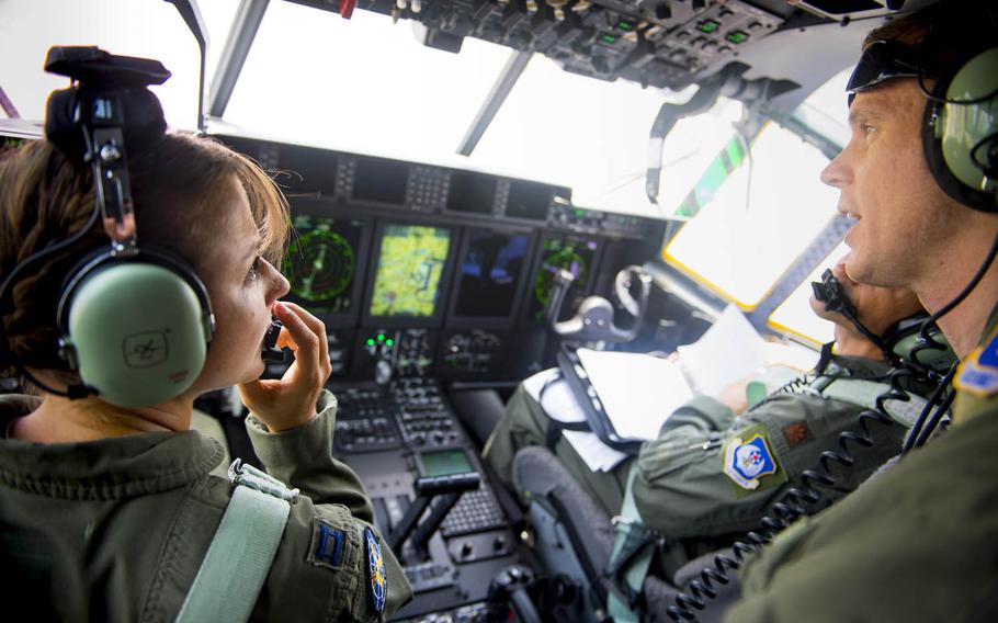 Air Force Capt. Christy Wise, left, an HC-130J pilot with the 71st Rescue Squadron at Moody Air Force Base, Ga., talks with her co-pilots on July 22, 2016, before her first flight since losing part of her leg in a paddleboard accident last year.