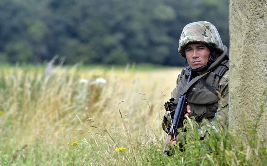 A soldiers from the Kazakh Peacekeeping Battalion assists with security during Exercise Steppe Eagle, on Thursday, July 28, 2016. KAZBAT saw extensive service from 2003-2008 in Iraq conducting ordnance location and disposal missions.