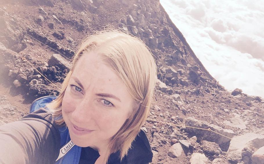 Jessica Bidwell, a Stars and Stripes staffer assigned to Okinawa, Japan, poses for a selfie at the summit of Mount Fuji, late last month.