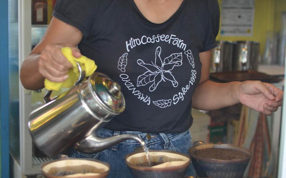 Hiro Coffee Farm owner Hiroko Adachi prepares a beverage for a customer in June 2016. She credits her comeback to the encouragement and rebuilding support she's received from customers after a series of typhoon wiped out the business in 2012.