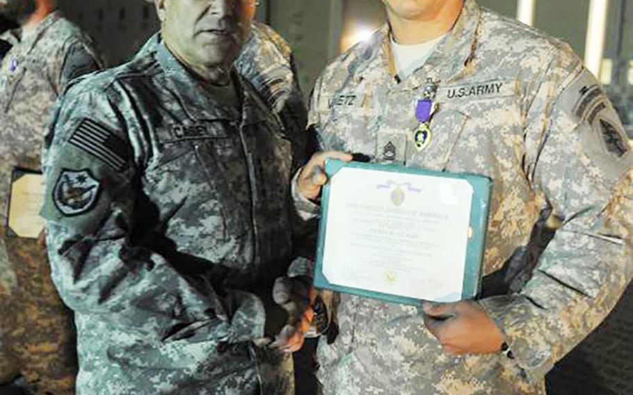 Sgt. 1st Class Anthony Venetz receives a Purple Heart in Afghanistan in October 2010, just months before his death.