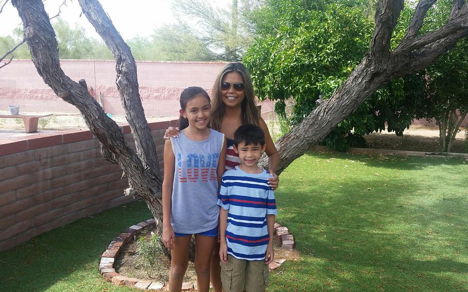 Debbie Venetz, center with her two children Alexa, 12, left and Jace, 8. The children were just small when their father Sgt. 1st Class Anthony Venetz died in Afghanistan in January 2011.