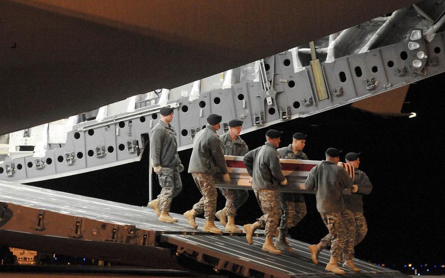 The casket of Sgt 1st Class Anthony Venetz, a decorate Special Forces soldier, arrives at Dover Air Force Base on Jan. 30, 2011. The circumstances of his death would later be called into question.