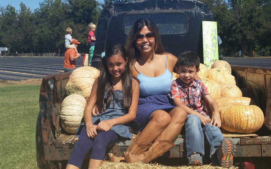 Debbie Venetz, center with her two children Alexa, left, 12, and Jace, 8. The children were just small when their father Sgt. 1st Class Anthony Venetz died in Afghanistan in January 2011.