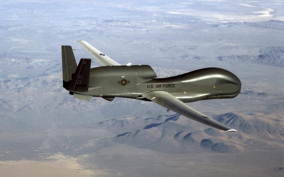 An RQ-4 Global Hawk soars through the sky to record intelligence, surveillance and reconnaissance data.