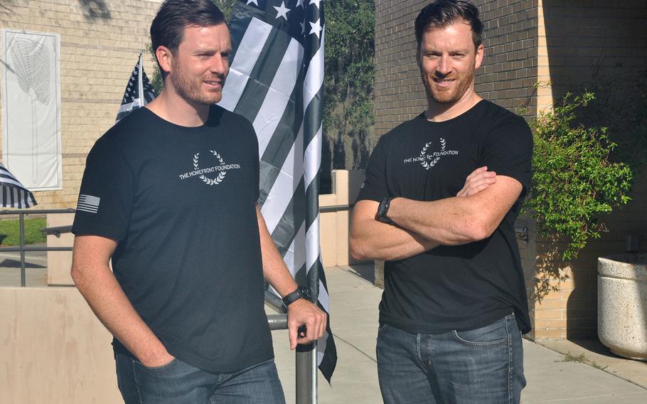 Matt Fetterman, left and twin brother Mark Fetterman stand outside the University of South Florida theater in Tampa on Aug. 27 ahead of the first storytelling workshop for their new Homefront Foundation.