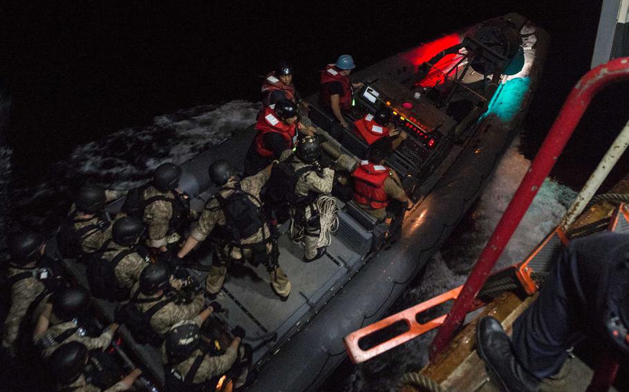 The USS San Antonio's medical response team departs on an inflatable boat to provide medical assistance to a sick crew member aboard the Liberian-registered cargo vessel Fernando Sept. 12, 2016. The crew member was transported to the San Antonio and later transferred to a hospital in Oman.