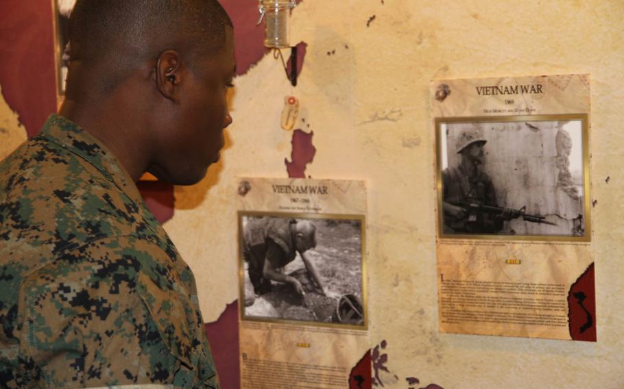 A Marine looks at a new display that shows off 3rd Marine Division history, Friday, Sept. 16, 2016, at Camp Courtney, Okinawa.