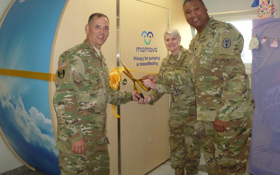 Col. Stephen Hall, deputy commander for Nursing at Landstuhl Regional Medical Center, Lt. Col. Cynthia Sanchez, LRMC chief nurse for Women's Health and Newborn Care and Col. (Dr.) Claude Burnett, LRMC chief of Women's Health and Newborn Care cut a ribbon on Sept. 15, 2016, officially opening the first Lactation Support Pod in a military facility in Europe.