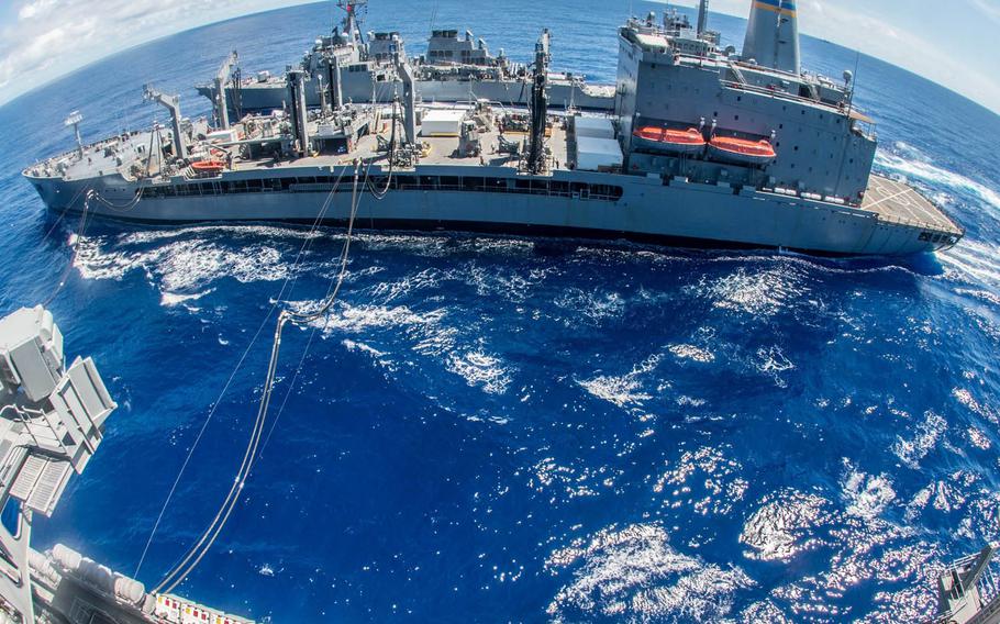 The USS John McCain steams alongside a replenishment oiler during Valiant Shield drills, Sept. 16, 2016. The Yokosuka-based destroyer will participate in a Naval Engagement Activity with Vietnam, along with sailors from Destroyer Squadron 7 and the Singapore-headquartered Commander Task Force 73.