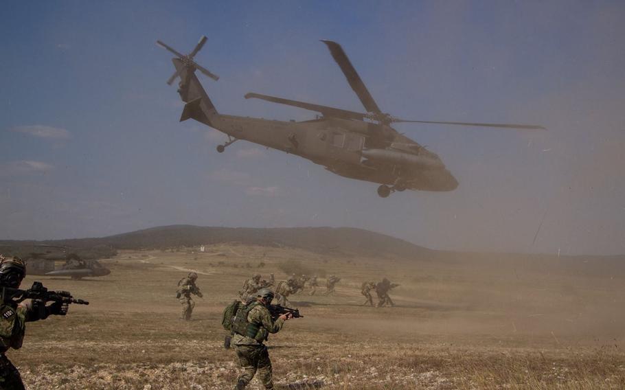U.S. Army special forces and their NATO counterparts conduct an air assault on a small compound during Brave Warrior 2016 at Bakony Combat Training Center, Hungary, Tuesday, Sept. 27, 2016.
